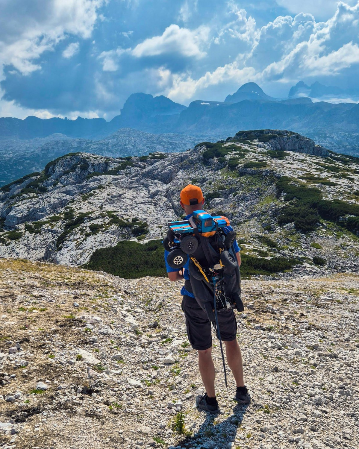 A 9C crawler strapped to a hiking pack on the Krippenstein plateau in the Austrian Alps